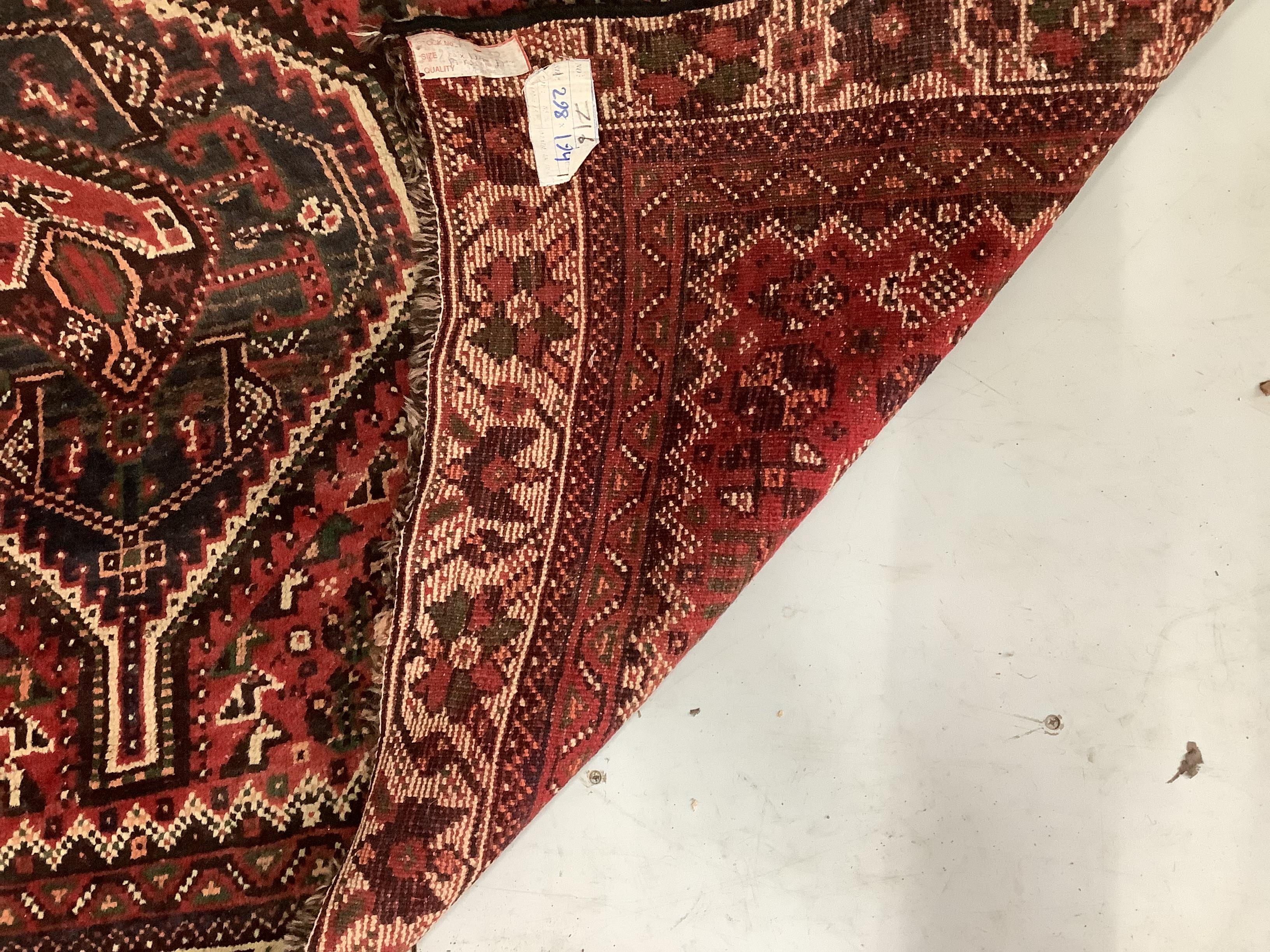 A North West Persian red ground carpet, 290 x 190cm